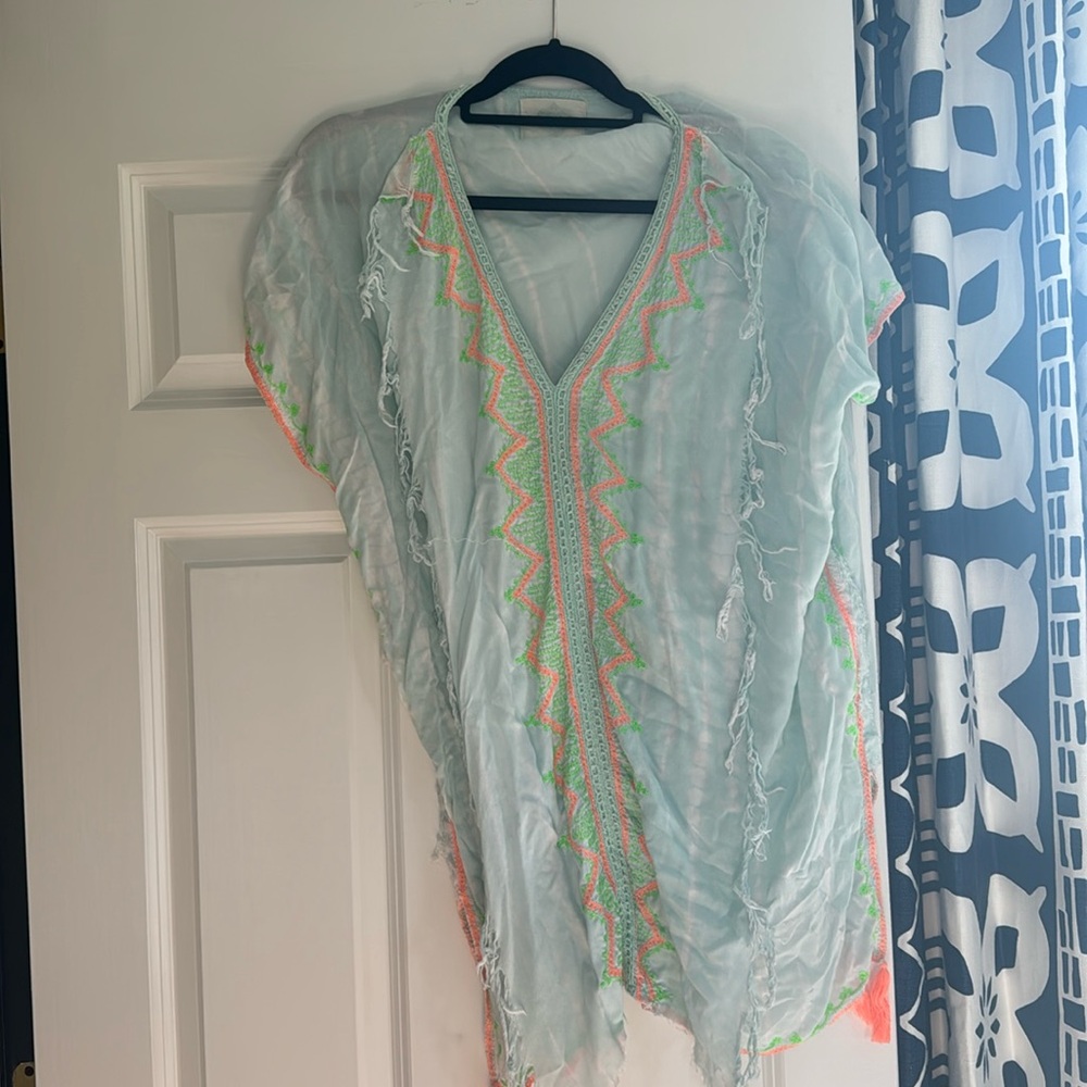 Light blue beach cover-up with neon, orange and neon green fringe trim